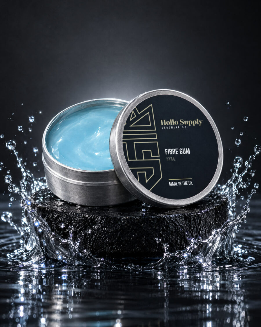 Fibre Gum (100ml) by Hollo Supply Grooming Co., photographed on wet charcoal stone with water