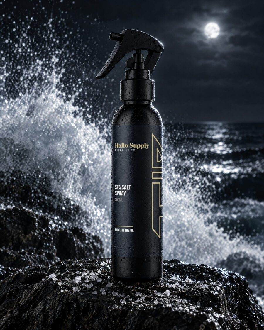 Sea Salt Spray by Hollo Supply Grooming Co., photographed on wet charcoal stone with water