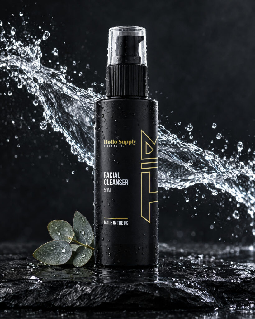Facial Cleanser by Hollo Supply Grooming Co., photographed on wet charcoal stone with water