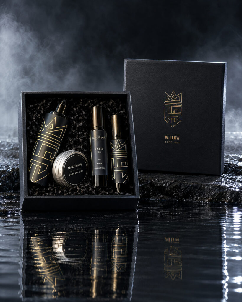 The Willow Gift Set by Hollo Supply Grooming Co., photographed on wet charcoal stone with water
